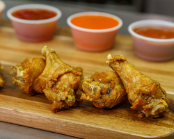 Plain Wings with Sauces in Background