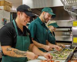 Group making Pizzas